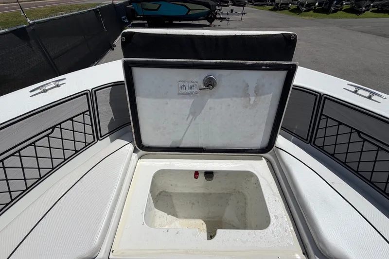Slide: The Image of The image shows the bow of a Wellcraft 202 Fisherman with an open storage compartment. - 30
