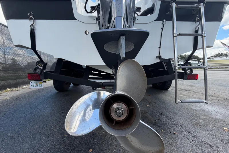 Slide: The Image of The image shows the stern of a Wellcraft 202 Fisherman boat with a large propeller and ladder. - 4