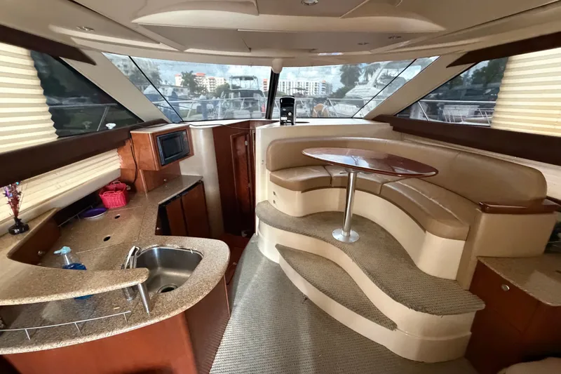 Slide: The Image of Luxurious interior of a 2008 Meridian 391 Sedan yacht with modern kitchen and seating area. - 44