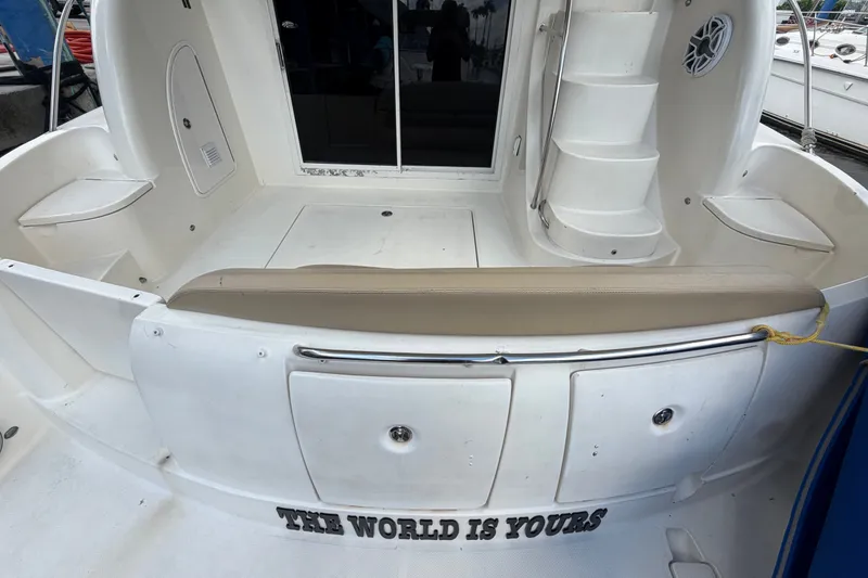 Slide: The Image of 2008 Meridian 391 Sedan yacht interior with seating and stairs, featuring "The World Is Yours" text. - 29