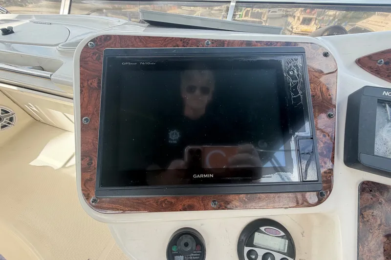 Slide: The Image of Garmin GPS display on 2008 Meridian 391 Sedan yacht dashboard with wood paneling. - 16