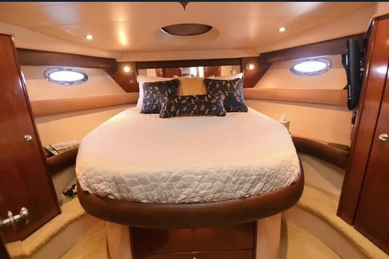 Slide: The Image of Luxurious bedroom interior of 2008 Meridian 391 Sedan yacht with elegant bedding and wood accents. - 10