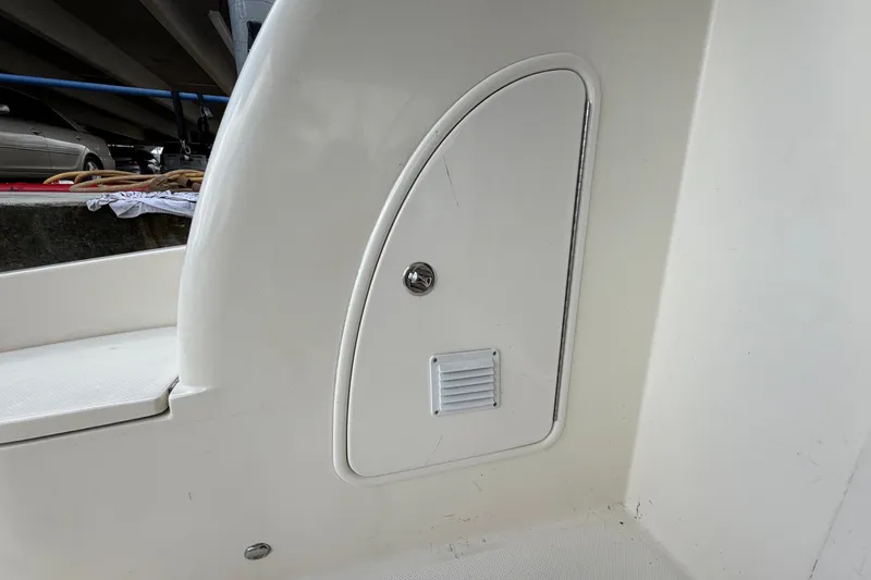 Slide: The Image of 2008 Meridian 391 Sedan boat interior compartment with vent and latch. - 36