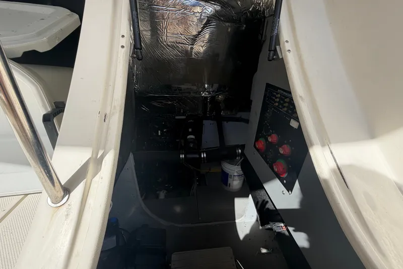 Slide: The Image of Engine compartment of a 2008 Meridian 391 Sedan boat, featuring control panel and insulation. - 84