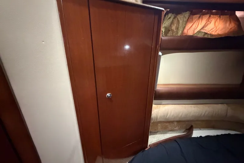 Slide: The Image of Interior of 2008 Meridian 391 Sedan with wooden cabinet and cozy bedding. - 75