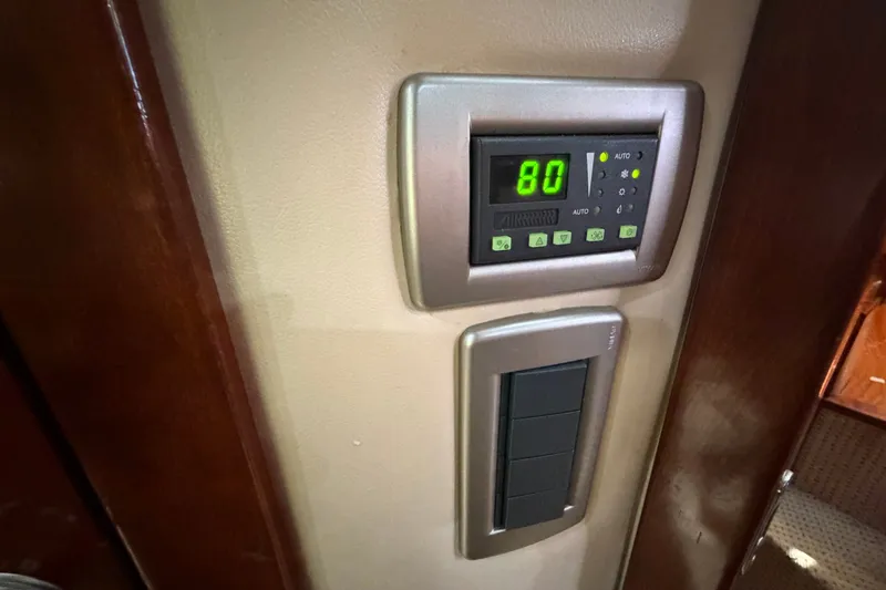 Slide: The Image of Digital control panel inside a 2008 Meridian 391 Sedan yacht, displaying temperature settings. - 72