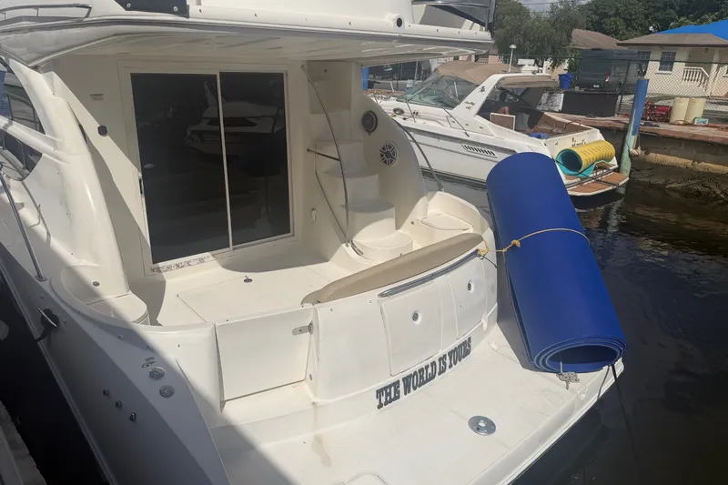 Slide: The Image of 2008 Meridian 391 Sedan yacht docked with blue mat on stern. - 9