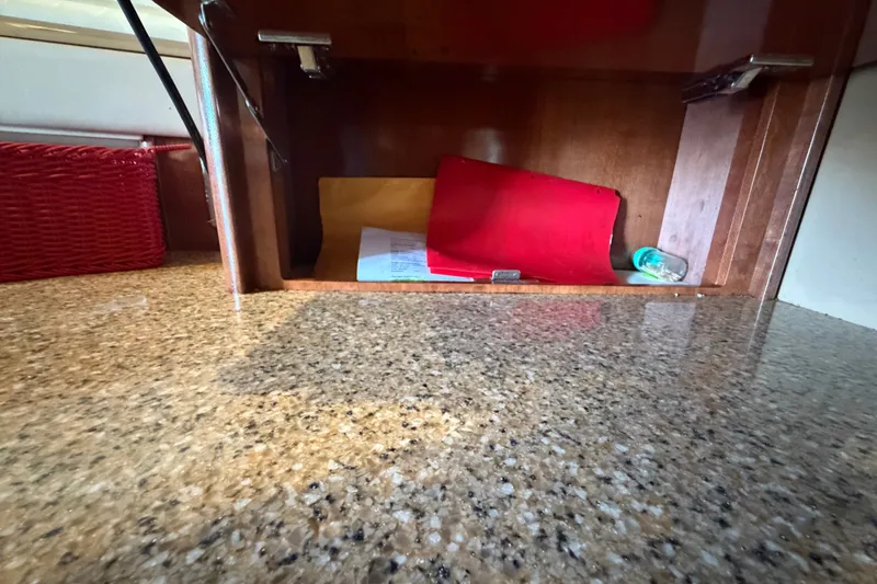 Slide: The Image of Open cabinet on 2008 Meridian 391 Sedan with granite countertop and red basket. - 57