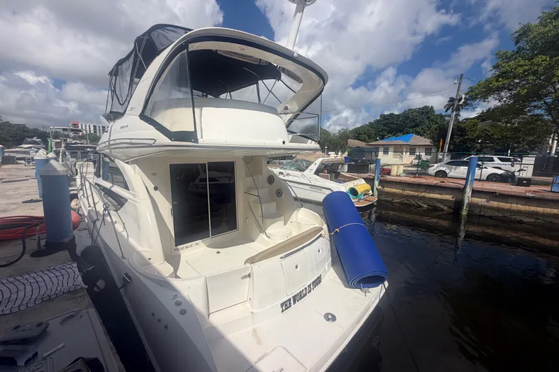 Slide: The Image of 2008 Meridian 391 Sedan yacht docked at marina under cloudy sky. - 8