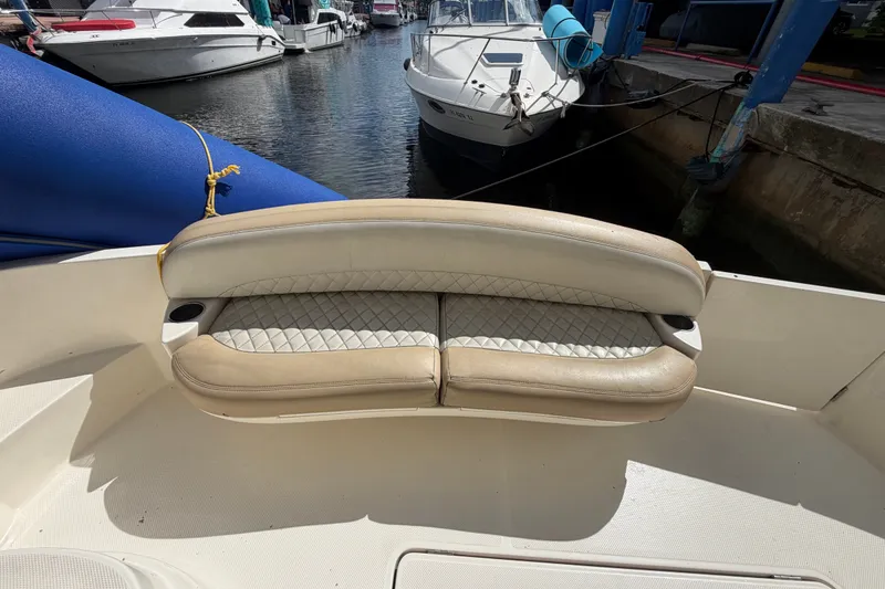 Slide: The Image of 2008 Meridian 391 Sedan boat seating area at marina with other boats docked nearby. - 28