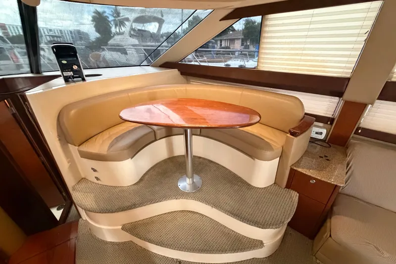 Slide: The Image of Luxurious interior of 2008 Meridian 391 Sedan with curved seating and wooden table. - 46