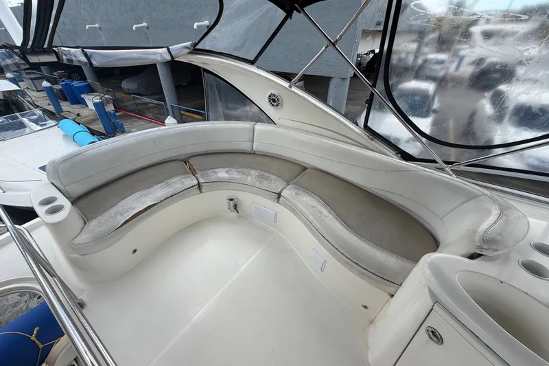 Slide: The Image of 2008 Meridian 391 Sedan boat interior with curved seating and cup holders. - 19