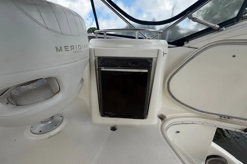 Slide: The Image of 2008 Meridian 391 Sedan yacht interior with seating and storage compartment. - 23