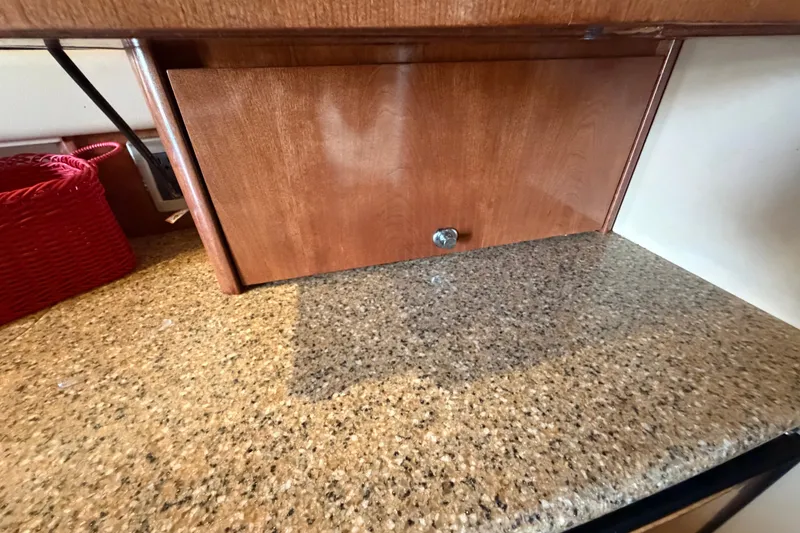 Slide: The Image of Wooden cabinet and granite countertop in 2008 Meridian 391 Sedan interior. - 56