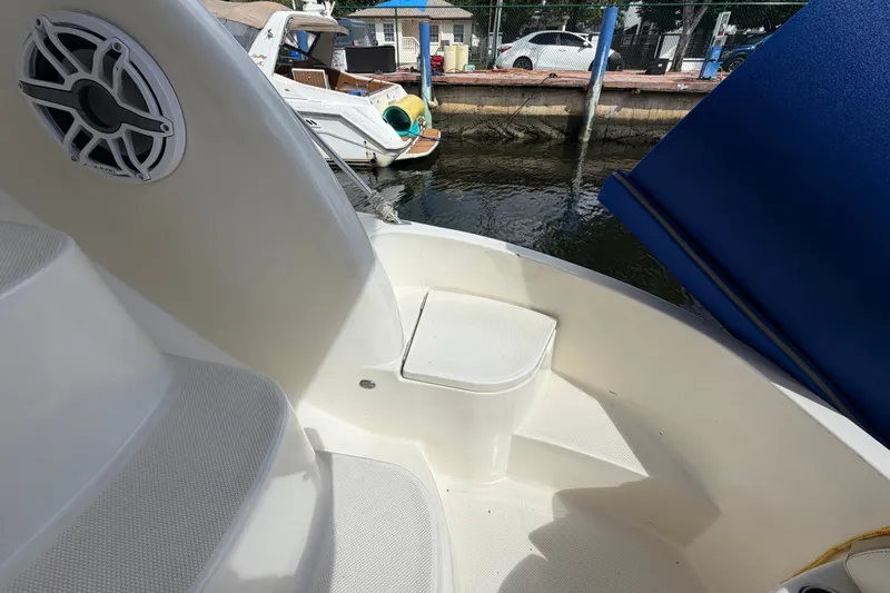 Slide: The Image of 2008 Meridian 391 Sedan boat deck with seating and speaker, docked by the water. - 34