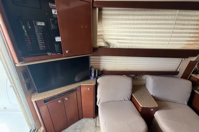 Slide: The Image of Interior of a 2008 Meridian 391 Sedan with TV, control panel, and seating area. - 49
