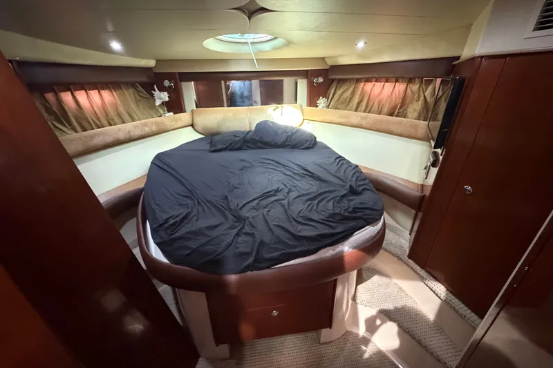 Slide: The Image of Luxurious cabin interior of 2008 Meridian 391 Sedan yacht with cozy bed and elegant wood finishes. - 63