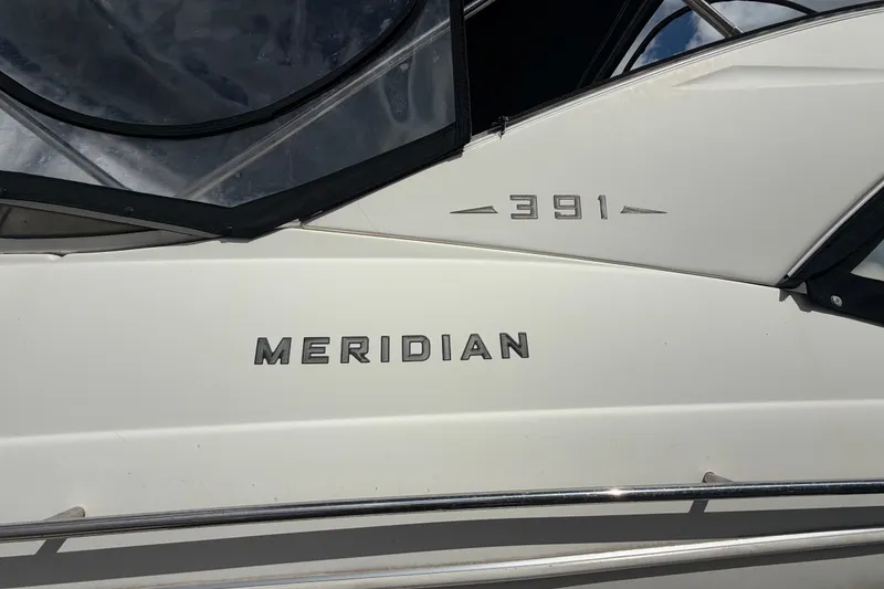 Slide: The Image of 2008 Meridian 391 Sedan boat exterior with model name and number displayed. - 38