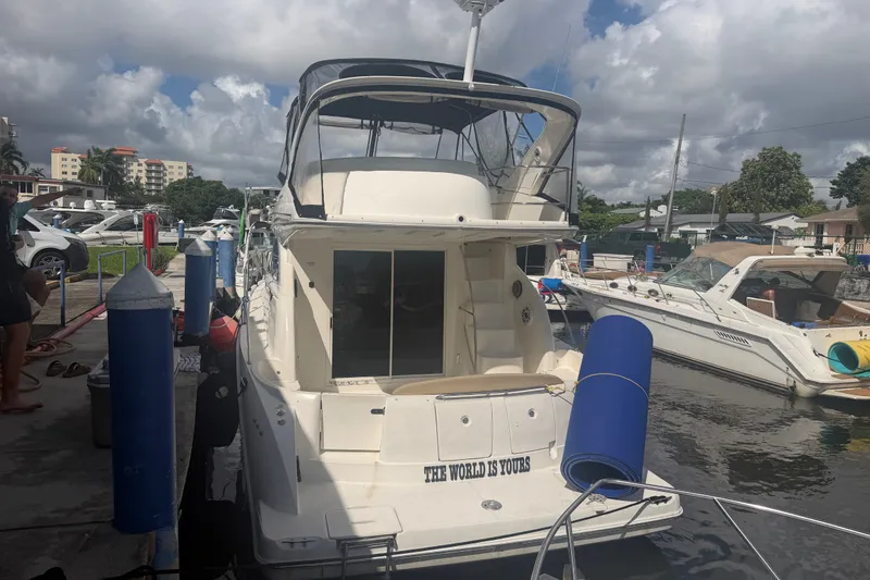 Slide: The Image of 2008 Meridian 391 Sedan yacht docked at marina under cloudy sky. - 7