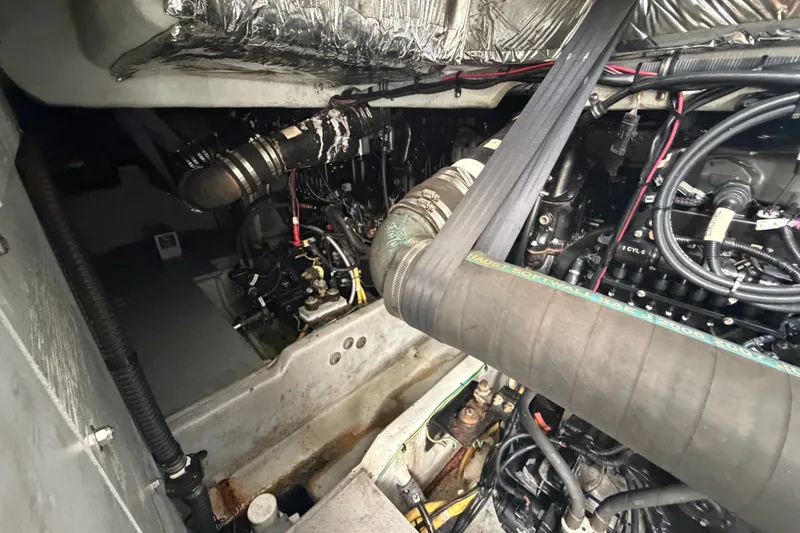 Slide: The Image of Engine compartment of a 2008 Meridian 391 Sedan boat, showcasing mechanical components and wiring. - 87
