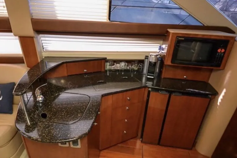 Slide: The Image of Luxurious 2008 Meridian 391 Sedan yacht interior with modern kitchen amenities. - 8