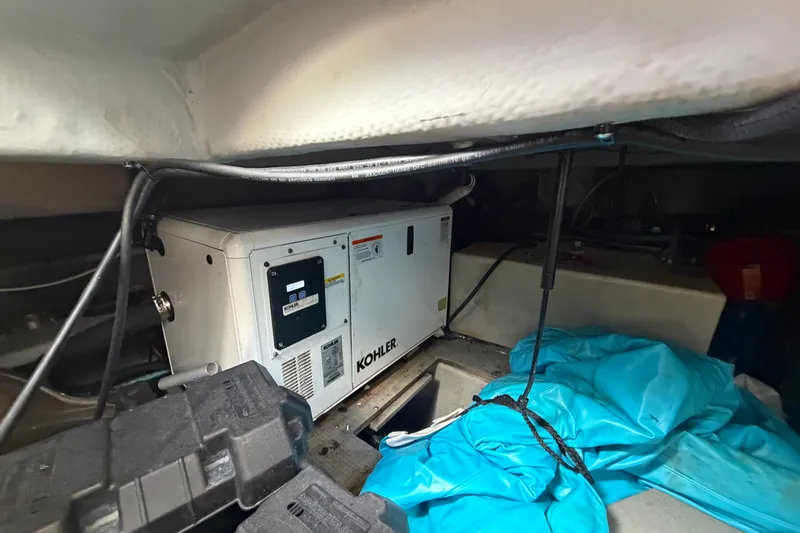 Slide: The Image of Engine room of 2008 Meridian 391 Sedan with Kohler generator and blue tarp. - 88