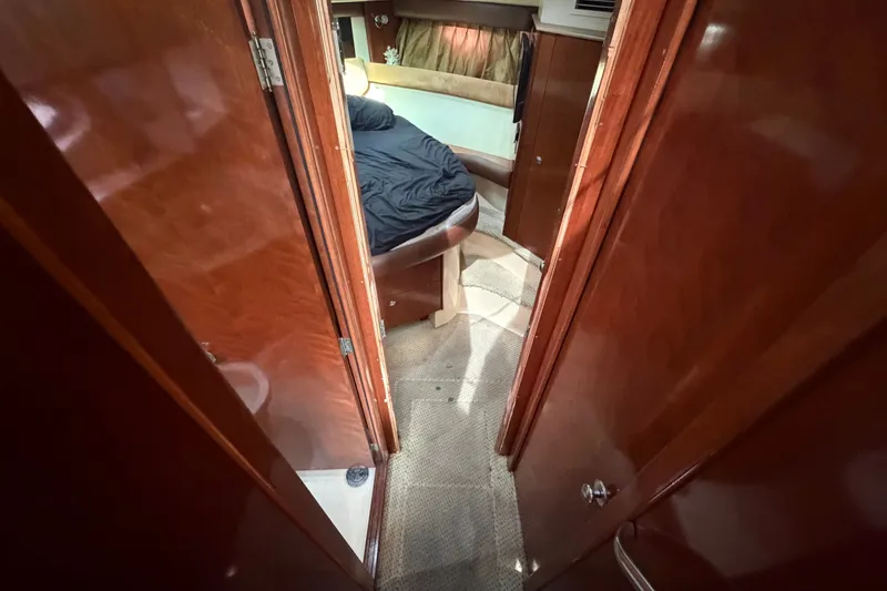 Slide: The Image of Interior view of 2008 Meridian 391 Sedan yacht cabin with wooden finish and cozy bed. - 60