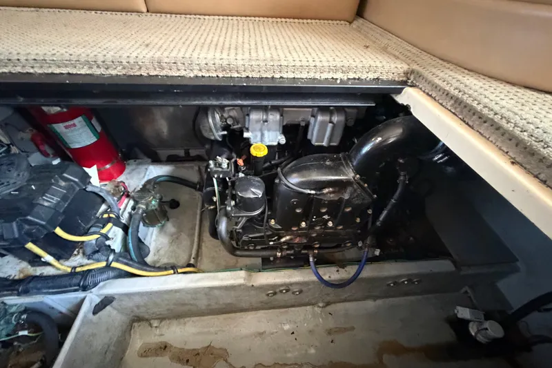 Slide: The Image of Engine compartment of a 2008 Meridian 391 Sedan boat, featuring mechanical components and wiring. - 82