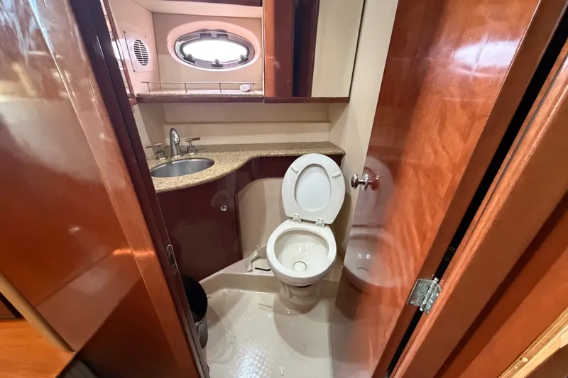 Slide: The Image of Luxurious bathroom in 2008 Meridian 391 Sedan yacht with modern fixtures and wood accents. - 61