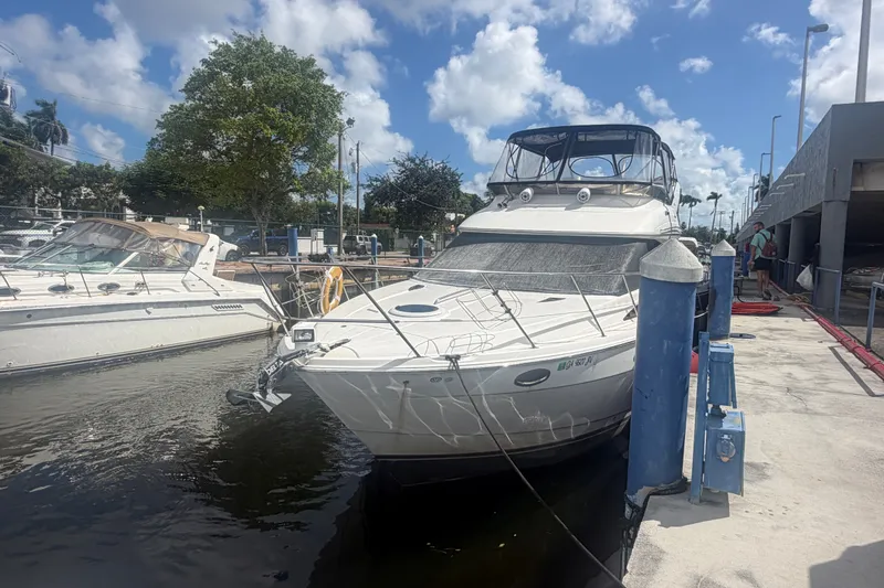 Slide: The Image of 2008 Meridian 391 Sedan yacht docked at marina under blue sky. - 5