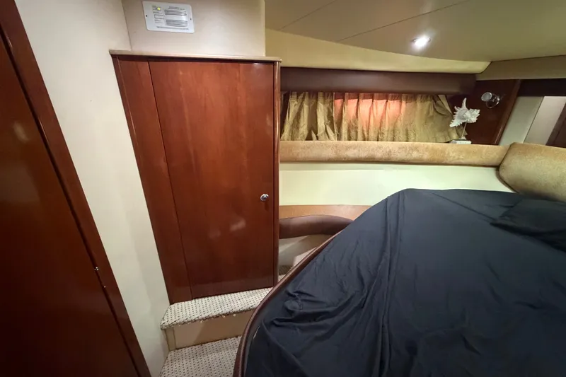 Slide: The Image of Interior of 2008 Meridian 391 Sedan yacht with wood paneling and cozy sleeping area. - 64