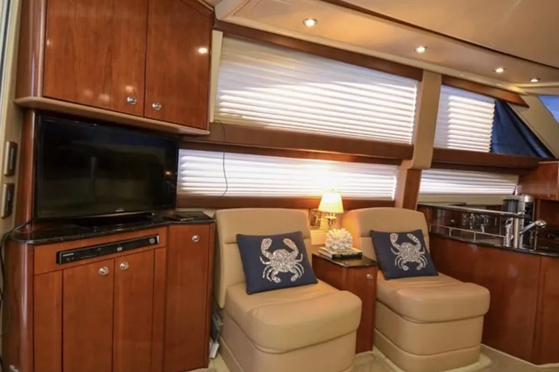 Slide: The Image of Luxurious interior of 2008 Meridian 391 Sedan yacht with plush seating and elegant cabinetry. - 7