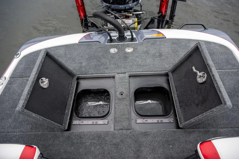 Slide: The Image of Manufacturer Provided Image: 2024 Skeeter FXR21 Apex boat deck with storage compartments and motor view. - 20