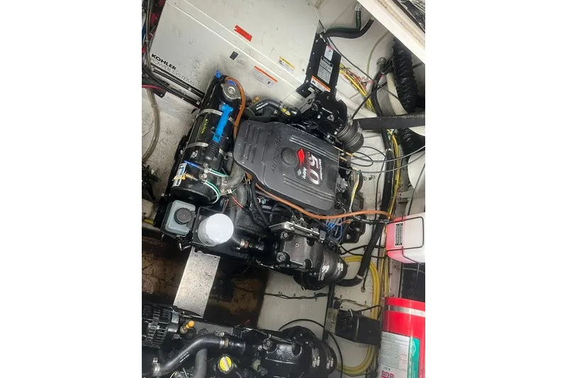 Slide: The Image of Engine compartment of a 2006 Maxum 3300 SE boat, featuring a MerCruiser engine. - 21
