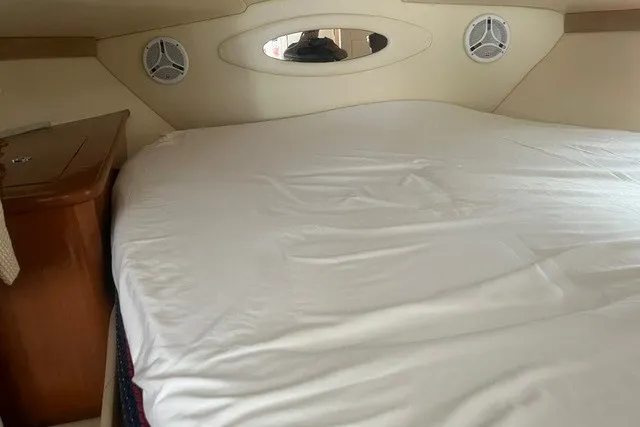 Slide: The Image of Interior cabin of 2006 Maxum 3300 SE boat with bed and speakers. - 18