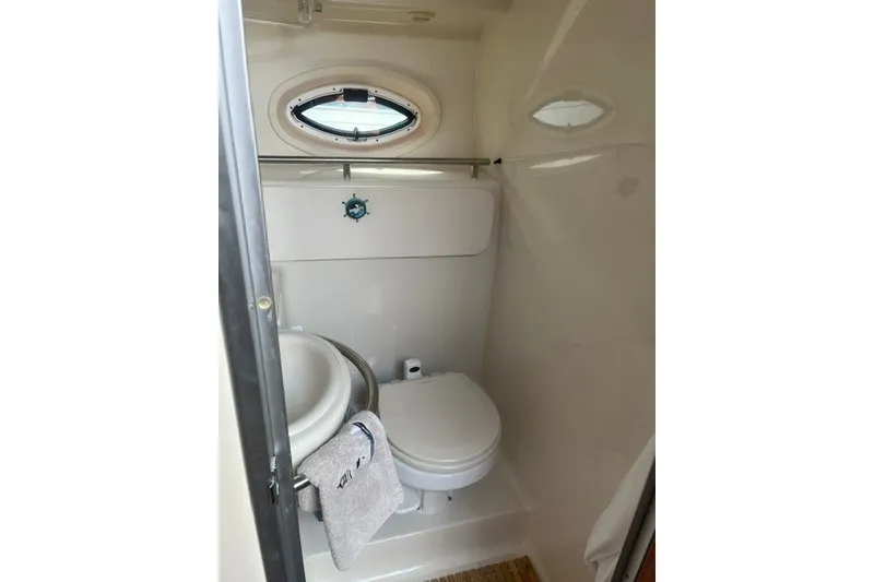 Slide: The Image of Compact bathroom in 2006 Maxum 3300 SE boat with porthole window. - 20