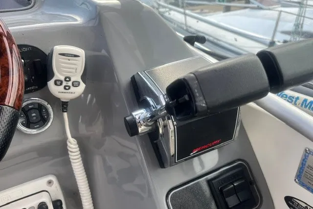Slide: The Image of Control panel of a 2006 Maxum 3300 SE boat with Mercury throttle. - 12
