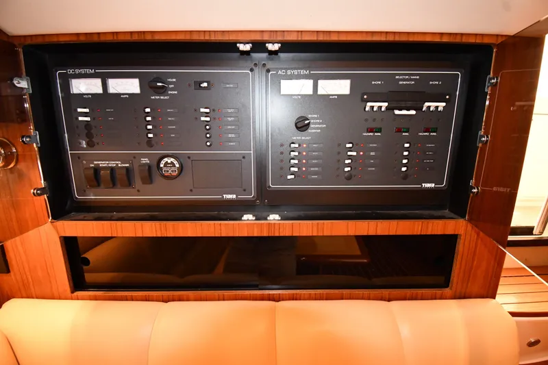 Slide: The Image of Electrical control panel on a 2004 Tiara Yachts 3500 Open boat interior. - 42