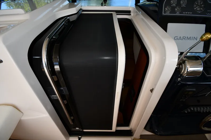 Slide: The Image of 2004 Tiara Yachts 3500 Open cabin entrance with Garmin navigation system. - 25
