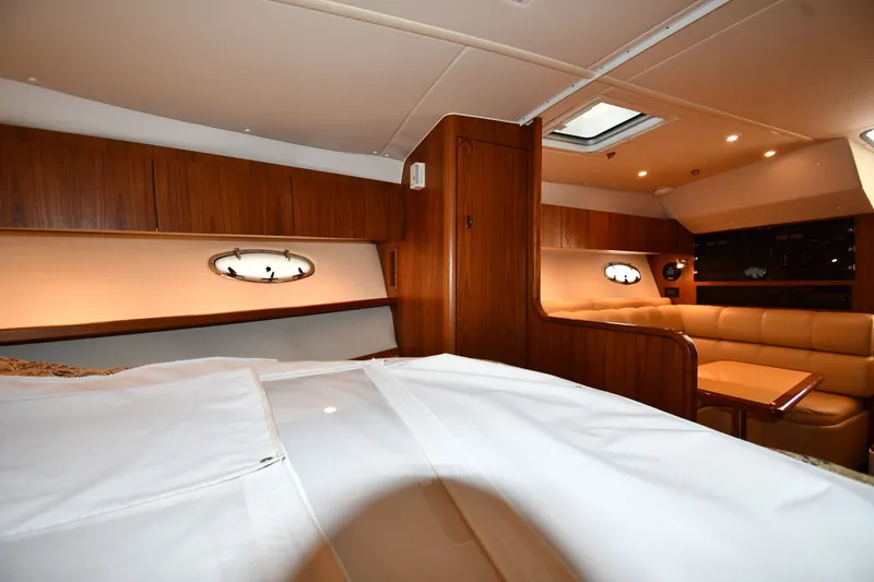 Slide: The Image of Luxurious interior of 2004 Tiara Yachts 3500 Open, featuring wood paneling and comfortable seating. - 30