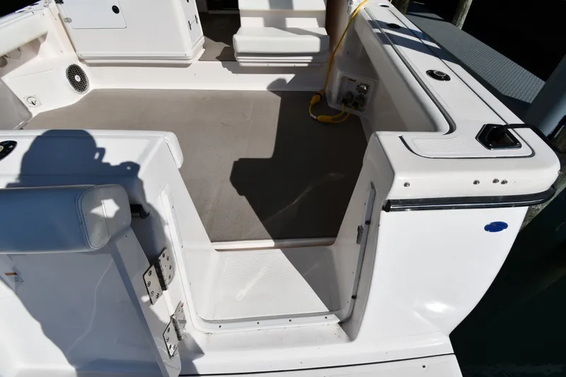 Slide: The Image of 2004 Tiara Yachts 3500 Open boat deck with seating and storage compartments. - 19