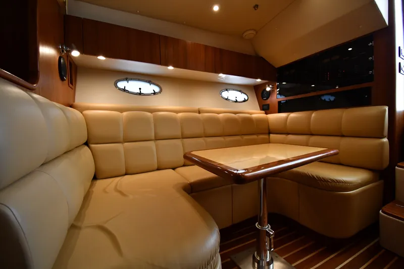 Slide: The Image of Luxurious interior of 2004 Tiara Yachts 3500 Open with plush seating and elegant table. - 34