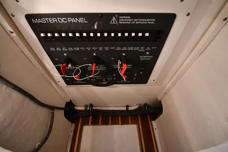 Slide: The Image of Master DC panel on a 2004 Tiara Yachts 3500 Open, featuring switches and wiring. - 43