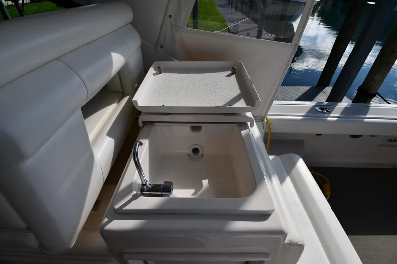 Slide: The Image of 2004 Tiara Yachts 3500 Open interior with sink and seating area. - 21