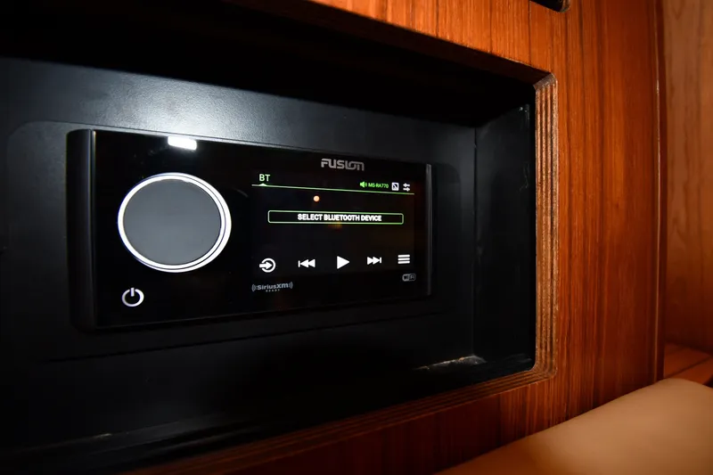 Slide: The Image of Fusion stereo system in 2004 Tiara Yachts 3500 Open, featuring Bluetooth connectivity. - 44