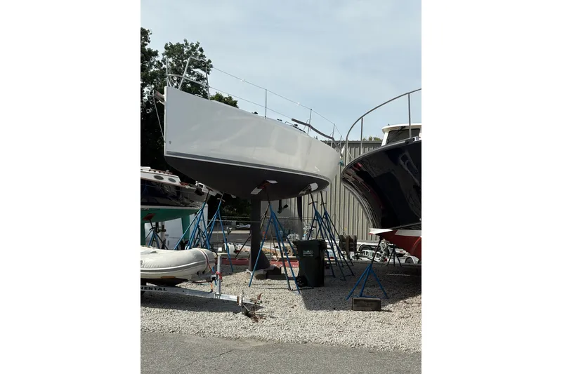 Slide: The Image of 2012 J Boats J/111 sailboat on stands in a boatyard. - 0
