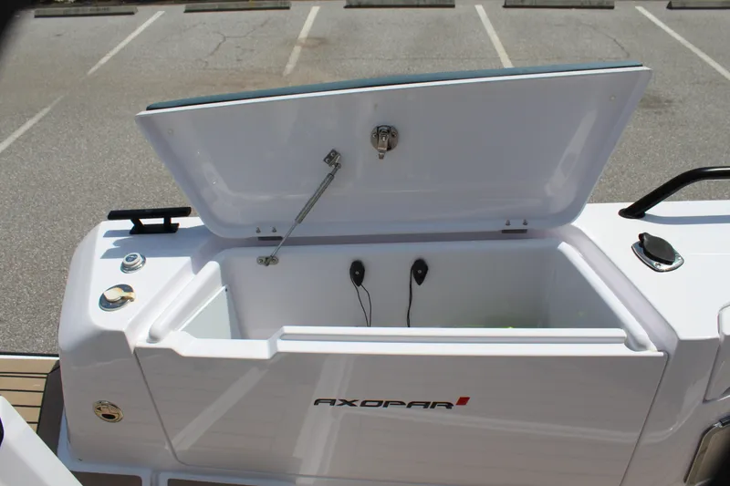 Slide: The Image of 2022 Axopar 37 XC Cross Cabin Brabus storage compartment open. - 30