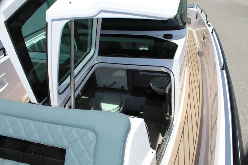 Slide: The Image of 2022 Axopar 37 XC Cross Cabin Brabus interior view with seating and cabin. - 38