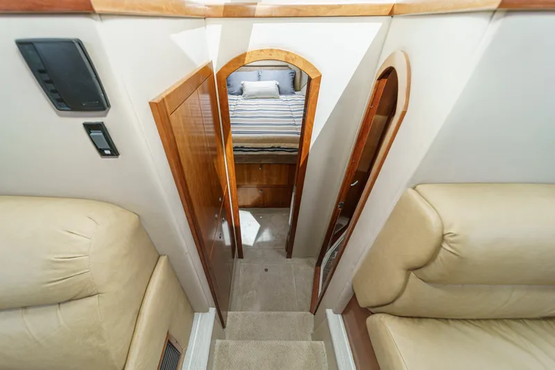 Slide: The Image of Interior view of 2008 Cruisers Yachts 415 Express Motoryacht, featuring cozy cabin and wooden accents. - 45