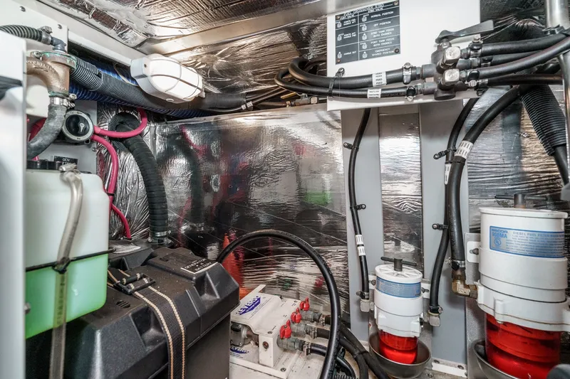 Slide: The Image of Engine room of 2008 Cruisers Yachts 415 Express Motoryacht with various mechanical components. - 66